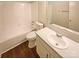 Clean bathroom featuring a tub, toilet, and a vanity with a white sink at 10905 Park Rd, Charlotte, NC 28226