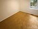 Cozy bedroom with a window view and carpeted floors at 10905 Park Rd, Charlotte, NC 28226