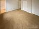 Spacious bedroom with neutral walls, carpeted floors and closet space at 10905 Park Rd, Charlotte, NC 28226