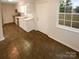 Bright kitchen with white cabinets and stainless steel appliances at 10905 Park Rd, Charlotte, NC 28226