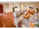 Bright living room with hardwood floors, modern decor, and ample seating at 10905 Park Rd, Charlotte, NC 28226
