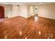 Spacious living room featuring hardwood floors and neutral color scheme at 10905 Park Rd, Charlotte, NC 28226