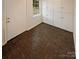 Functional mudroom featuring storage cabinets and tile flooring at 10905 Park Rd, Charlotte, NC 28226