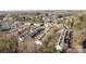 An aerial view of cozy townhomes nestled in a wooded community, offering comfort and convenience at 11013 Dundarrach Ln, Charlotte, NC 28277