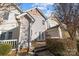 View of the back of a home featuring a porch with chairs and a small yard at 11013 Dundarrach Ln, Charlotte, NC 28277