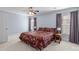 Comfortable bedroom with ceiling fan, windows with curtains, and carpet flooring at 11013 Dundarrach Ln, Charlotte, NC 28277