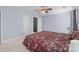 Bedroom with carpet floor, ceiling fan, and doors leading to other rooms at 11013 Dundarrach Ln, Charlotte, NC 28277