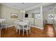 Spacious dining area with a large table and a view to the living room at 11013 Dundarrach Ln, Charlotte, NC 28277