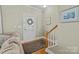 Inviting foyer featuring hardwood floors, staircase and neutral color palette at 11013 Dundarrach Ln, Charlotte, NC 28277