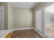 Kitchen area featuring tiled floors and door with natural light at 11013 Dundarrach Ln, Charlotte, NC 28277