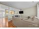 Bright living room featuring an open floor plan and a decorative fireplace at 11013 Dundarrach Ln, Charlotte, NC 28277