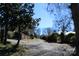 Picturesque view of private driveway leading to the home, surrounded by lush greenery at 121 Quincy Dr # 1, Belmont, NC 28012