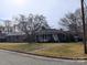 Charming single-story home with mature trees, a well-maintained lawn, and a welcoming front porch at 121 Quincy Dr # 1, Belmont, NC 28012