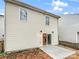 Back exterior view of home with vinyl siding and access to the backyard patio at 13413 Glasgow Green Ln, Charlotte, NC 28213