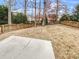 Spacious backyard with a wooden fence and a concrete patio at 13413 Glasgow Green Ln, Charlotte, NC 28213