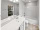 Bright bathroom featuring a shower and tub combo with tile flooring at 13413 Glasgow Green Ln, Charlotte, NC 28213