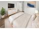 Bright bedroom with a large bed, modern furnishings, and wood floors at 13413 Glasgow Green Ln, Charlotte, NC 28213