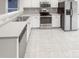 Kitchen with white cabinets, stainless steel appliances, and tile flooring at 13413 Glasgow Green Ln, Charlotte, NC 28213