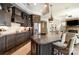 Spacious kitchen featuring a large island, modern pendant lighting, and a seamless transition into the living area at 15103 Honeycutt Dr, Huntersville, NC 28078