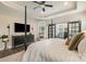 Bright main bedroom with tray ceiling, featuring a cozy sitting area and plenty of natural light at 15103 Honeycutt Dr, Huntersville, NC 28078
