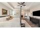 Beautifully staged primary bedroom featuring an en suite bathroom, neutral colors, and elegant furniture at 15103 Honeycutt Dr, Huntersville, NC 28078