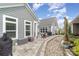 Scenic view of the outdoor patio area, featuring dining and sitting arrangements, grill and landscaping at 15103 Honeycutt Dr, Huntersville, NC 28078