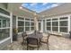 Charming patio with a dining set, umbrella for shade, and complemented by garden decor at 15103 Honeycutt Dr, Huntersville, NC 28078