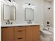 This bathroom features double sinks, modern fixtures, and a bathtub at 1516 N Caldwell St, Charlotte, NC 28206