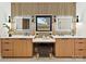 A bathroom features modern lighting, a vanity, and dual sinks at 1516 N Caldwell St, Charlotte, NC 28206