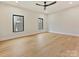 Bright bedroom boasts hardwood floors, neutral walls, recessed lights, and a modern ceiling fan at 1516 N Caldwell St, Charlotte, NC 28206