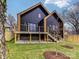 Modern, black two-story home with a deck and fenced yard offers style and privacy at 1516 N Caldwell St, Charlotte, NC 28206