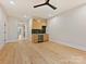 A living room features a bar area and a large hardwood floor at 1516 N Caldwell St, Charlotte, NC 28206