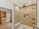 A modern, frameless shower featuring rainfall shower head and a built-in shower bench at 1516 N Caldwell St, Charlotte, NC 28206