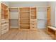 A spacious walk-in closet featuring built-in shelves and drawers at 1516 N Caldwell St, Charlotte, NC 28206