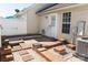 Back patio area with brick accents, white fence, AC unit, and a door into the house at 1517 Tiana Way, Rock Hill, SC 29732