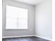 Bedroom with a large bright window to illuminate the room and dark wood-look floors at 1517 Tiana Way, Rock Hill, SC 29732