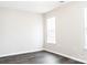 Bright bedroom with modern flooring, neutral walls, and natural light from the window at 1517 Tiana Way, Rock Hill, SC 29732