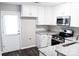Well-lit kitchen boasting granite countertops, stainless steel appliances, and ample cabinet space at 1517 Tiana Way, Rock Hill, SC 29732