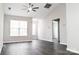 Bright living room with vaulted ceilings, windows with blinds, and dark wood flooring at 1517 Tiana Way, Rock Hill, SC 29732
