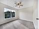 Bright bedroom featuring a large window, neutral carpet, and fresh paint at 1555 Andora Dr, Rock Hill, SC 29732