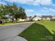 Long driveway showcasing detached garages and backyard at 1555 Andora Dr, Rock Hill, SC 29732