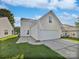 Exterior view of the home showing the garage and a well-maintained lawn at 1555 Andora Dr, Rock Hill, SC 29732