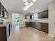 Well-lit kitchen boasts stainless steel appliances, granite countertops, and tile backsplash at 1555 Andora Dr, Rock Hill, SC 29732