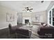 Bright living room with stylish fireplace, ceiling fan, and modern decor at 1555 Andora Dr, Rock Hill, SC 29732