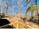 Spacious, wooded backyard with mature trees, fencing, and natural landscaping at 177 Highland Woods Ct, Denver, NC 28037