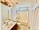 A well-lit bathroom with a shower-tub combo, a white toilet, and a vanity with a mirror at 177 Highland Woods Ct, Denver, NC 28037