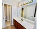 Bathroom featuring a large vanity with ample counter space, and a large mirror with Hollywood style lighting at 177 Highland Woods Ct, Denver, NC 28037