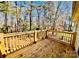 Wood deck with wooden railings overlooking spacious backyard and wooded area at 177 Highland Woods Ct, Denver, NC 28037