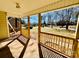 Charming covered porch with wood railing, offering an inviting outdoor space at 177 Highland Woods Ct, Denver, NC 28037