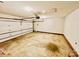 Spacious garage with white walls, a roll-up door, and ample room for storage or parking at 177 Highland Woods Ct, Denver, NC 28037